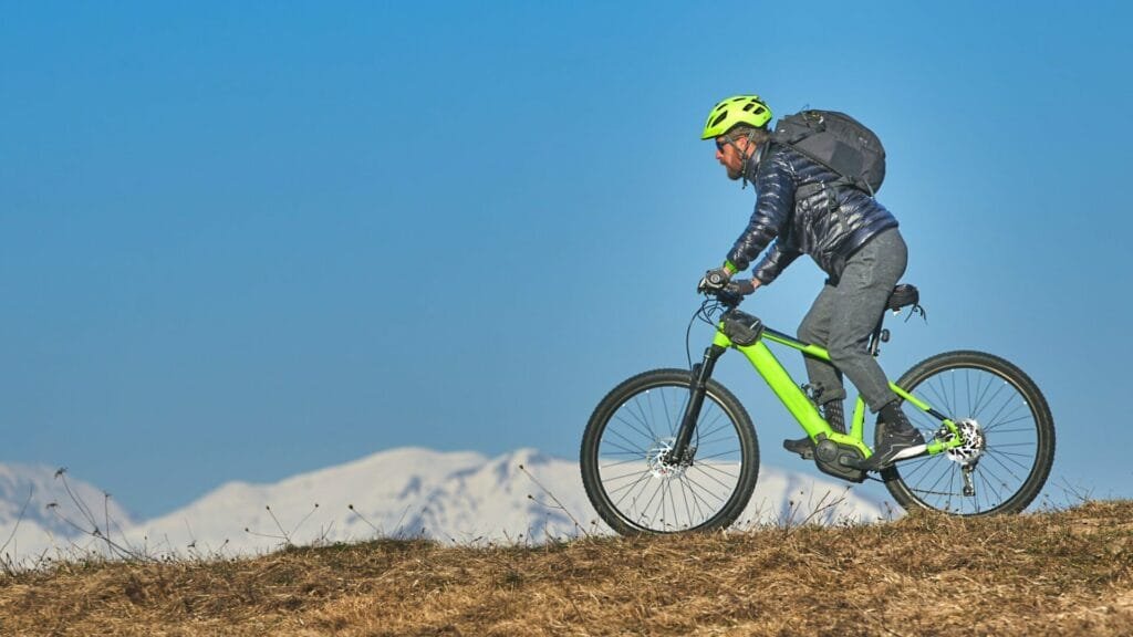 Man with beard in mountain bike
