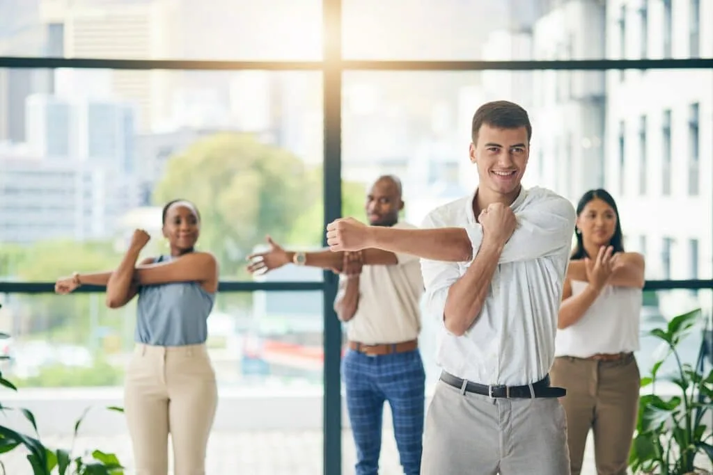 Workout, stretching and a group of business people in the office to exercise for health or mobility